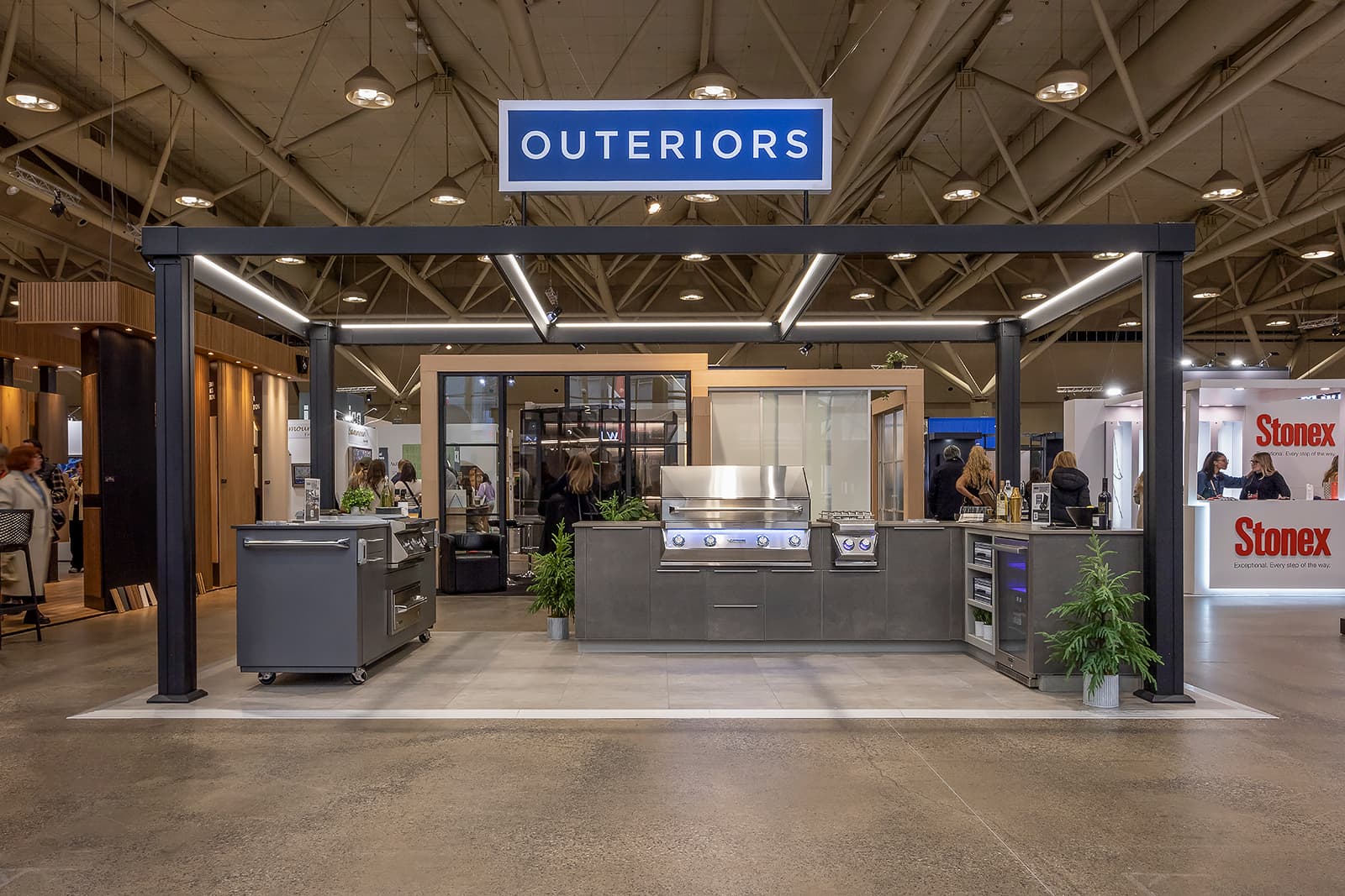 Outeriors trade show booth with outdoor kitchen display